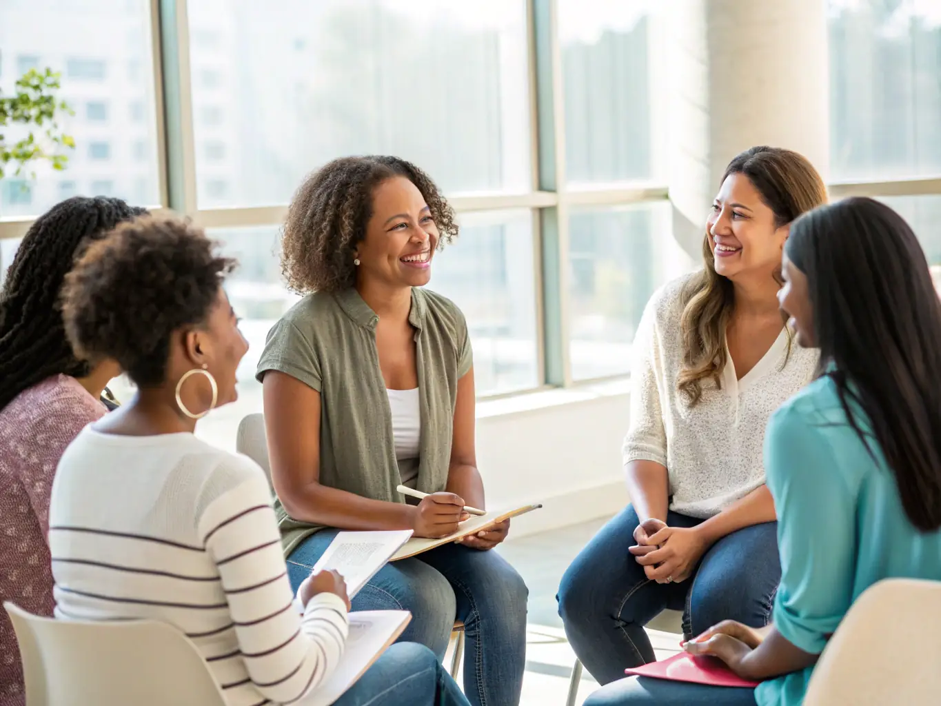 A serene image of a group of women sitting in a circle, bathed in soft light, sharing stories and experiences, symbolizing the power of connection and feminine support.